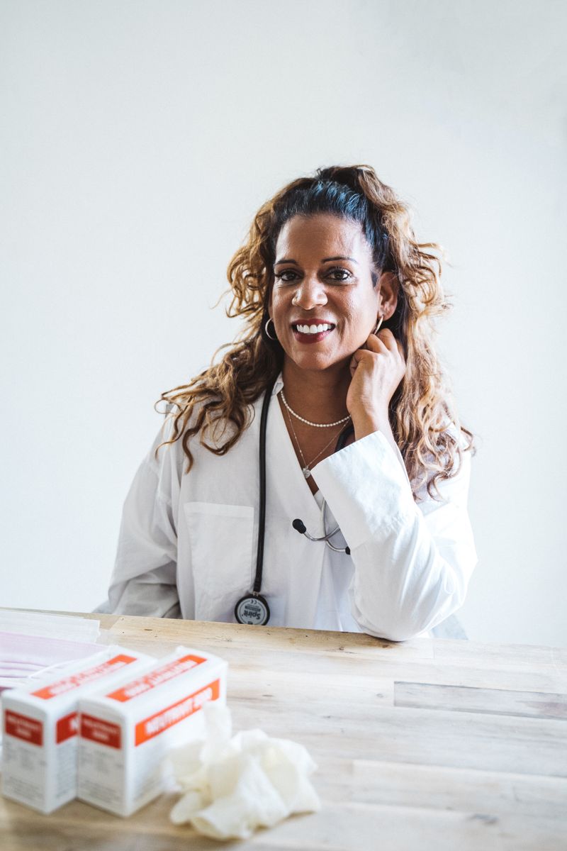 Dr. Anjali Mehta in a white lab coat at her desk